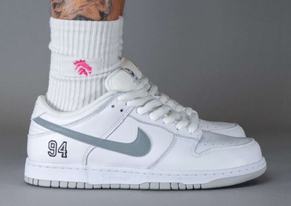 Supreme Nike SB Dunk Low White Metallic Silver On Foot 1068x757